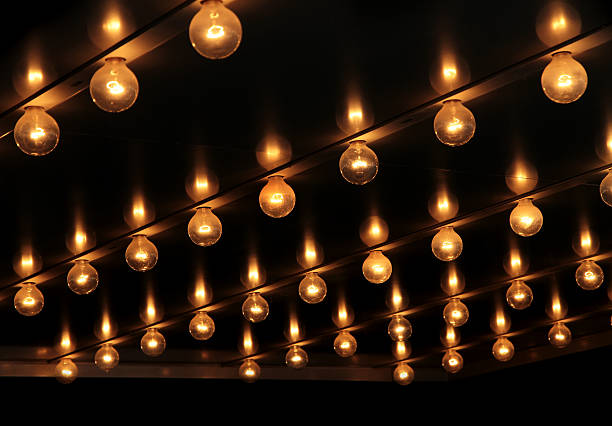 Lights under theatre marquee sign.