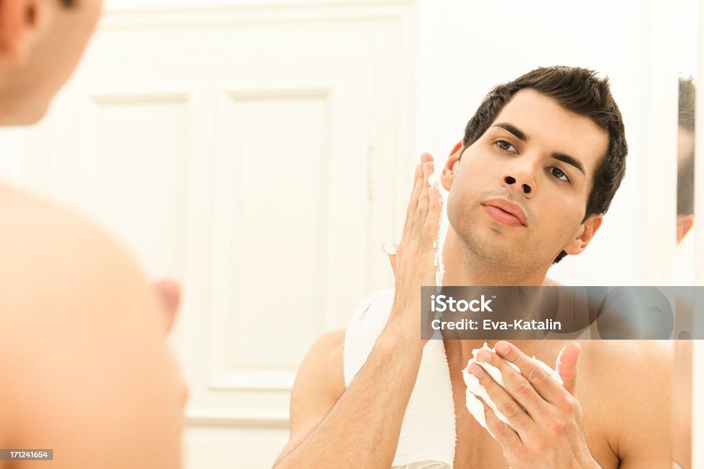 Young man using shaving cream Latin American and Hispanic Ethnicity Stock Photo