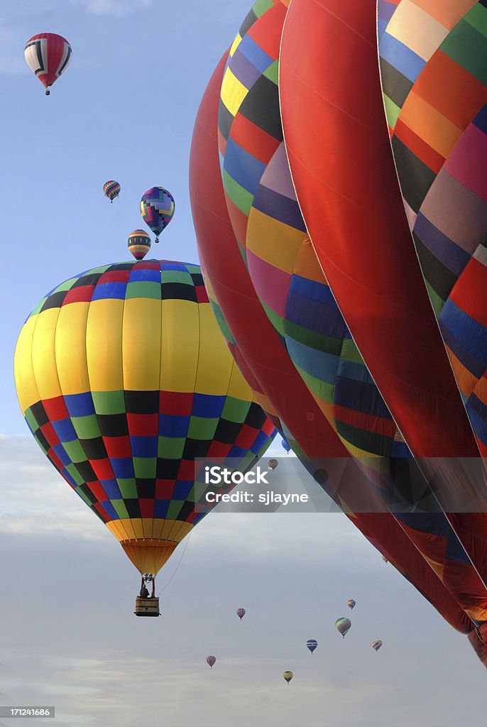 Flying High "Colorful hot air balloons flying high, in the bright sunlight, in a balloon festival near Albuquerque, New Mexico" Hot Air Balloon Stock Photo