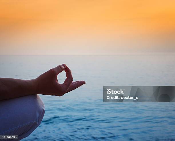 Meditation By The Ocean And Sky Stock Photo - Download Image Now - Mindfulness, Adult, Adults Only