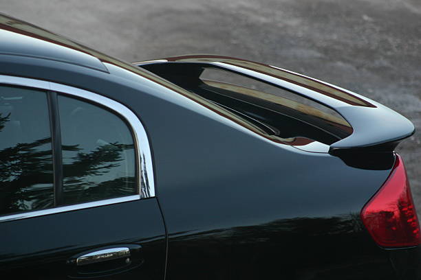 Car Spoiler Rear deck spoiler on an executive class sports sedan spoiler stock pictures, royalty-free photos & images