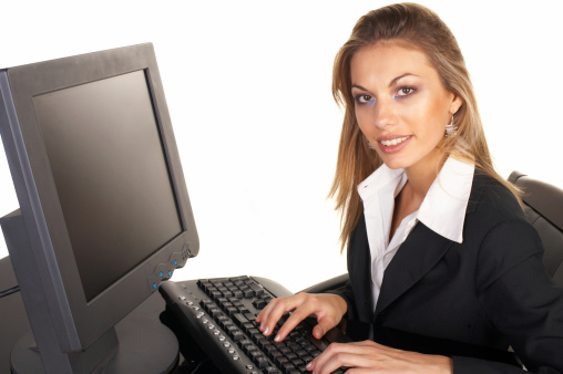 Cheerful businesswomen. Confident middle-aged businesswoman sitting at her working place