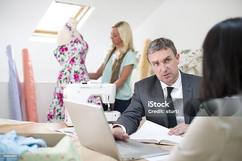 small business advice consultant chats to small business owner Meeting Stock Photo