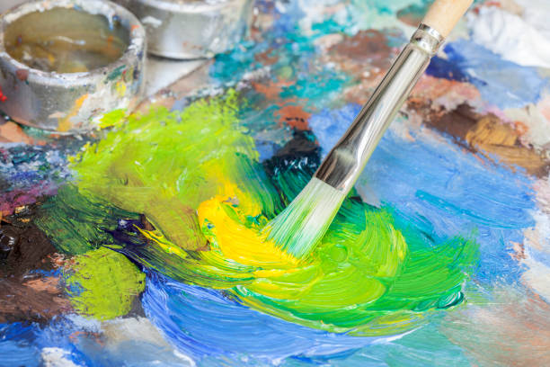 istock Paintbrush with oil paint on a classical palette 171242160