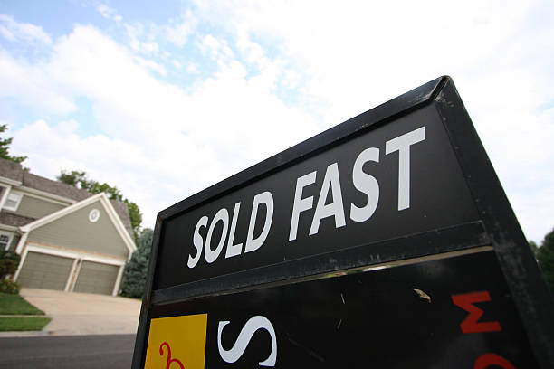 Sold Fast Real estate sign stock photo