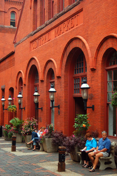 View of shoppers in Downtown Columbus Ohio's North Market near the Destination Donuts stand