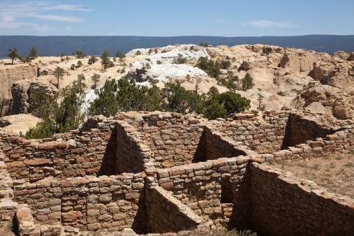 Rancho de Taos, New Mexico, USA - August 15, 2020: Side view of the historic San Francisco de Asis Catholic Church on a sunny summer day.