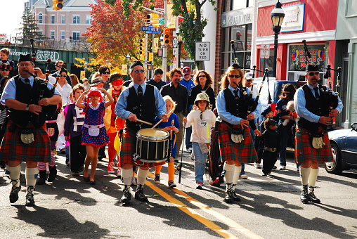 Cranford, NJ, USA October 24 Bagpipe musicians and drummers lead a parade of costumed children and adults during a Halloween parade in Cranford, New Jersey