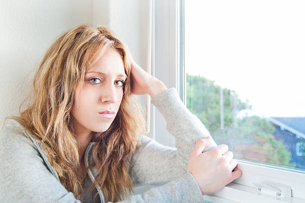istock Sad Girl By The Window 171242592