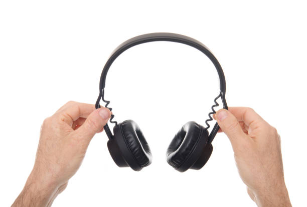 istock Holding professional headphone isolated on white 171245585