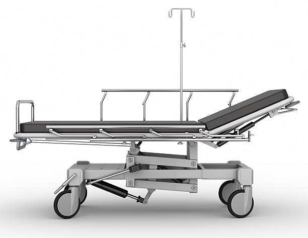 Side-profile view of stretcher parked on white background Clinic patient stretcher trolley. stretcher stock pictures, royalty-free photos & images