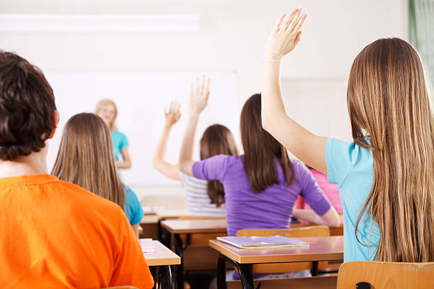istock Pupils in classroom responding to the teacher's question. 171245939