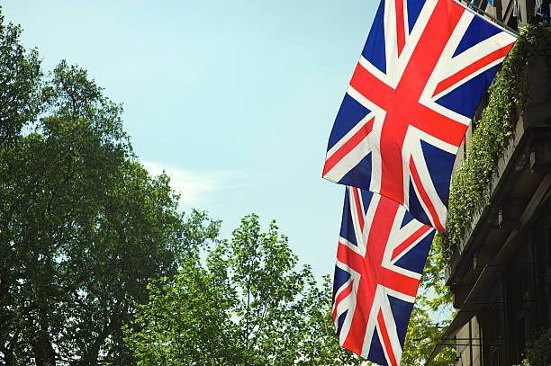 istock Union Jack British Flags Green Trees London 171246142
