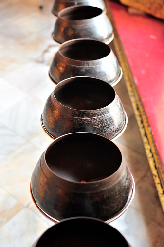 Tibetan singing bowls on the floor in a yoga studio.