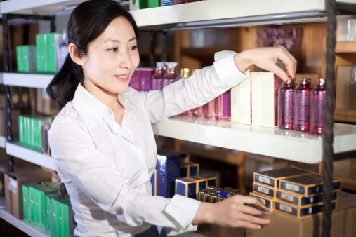 East asian women buying cosmetics in a small supermarket