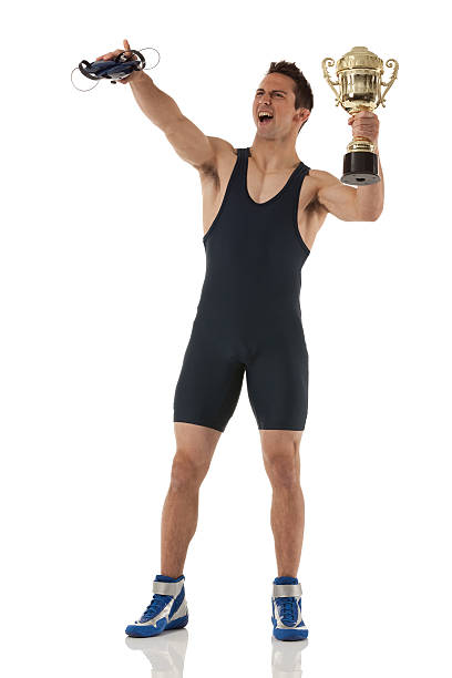 istock Wrestler holding a trophy and shouting 171248675