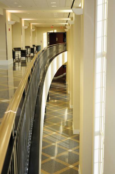 istock Curved balcony in long building hallway 171249124