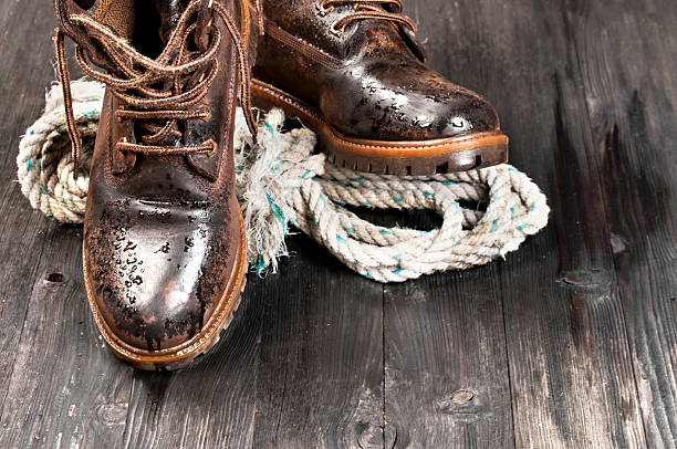 istock Wet hiking boot and rope 171250626