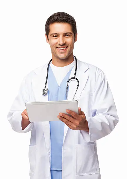 Portrait of a happy young doctor using digital tablet. Vertical shot. Isolated on white.
