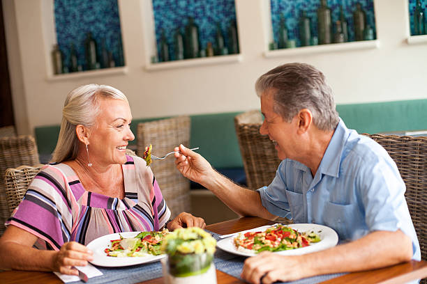 istock Senior couple eating together 171251979