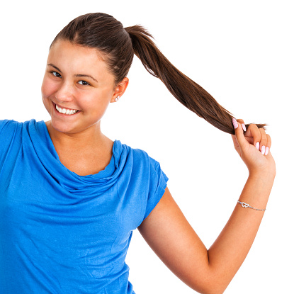 A young girl with long hair in a ponytail.