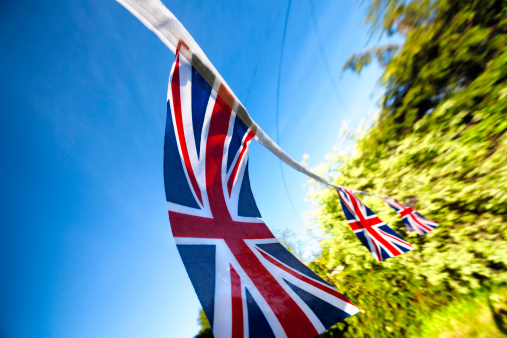 Union Jack bunting in sunlight with lens flare. Useful for the Queen's Diamond Jubillee and the . Games in 2012.