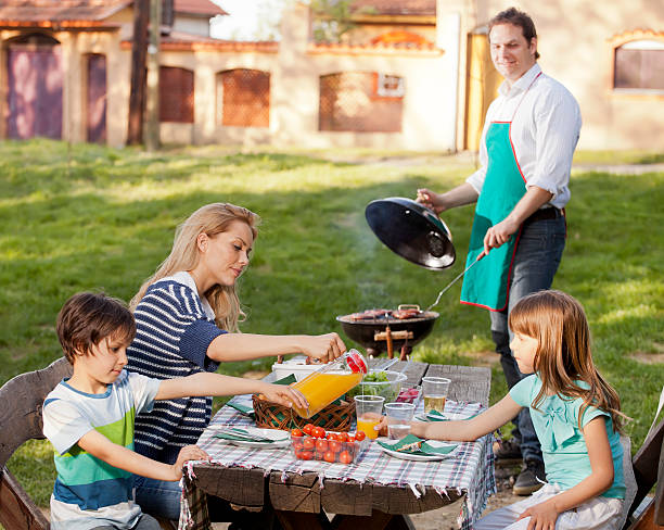 istock Family enjoying a barbeque 171252525