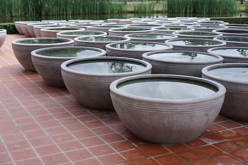 a row of bowls on the ground.