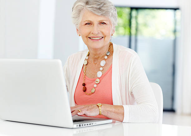 istock Elegant senior woman browsing the internet 171252833