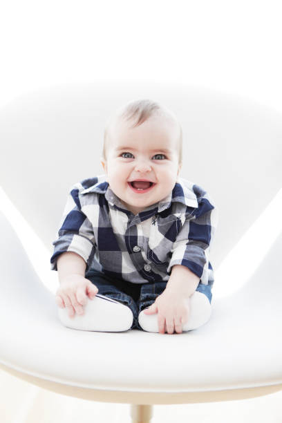 istock Happy Baby on White Chair Vertical 171253073