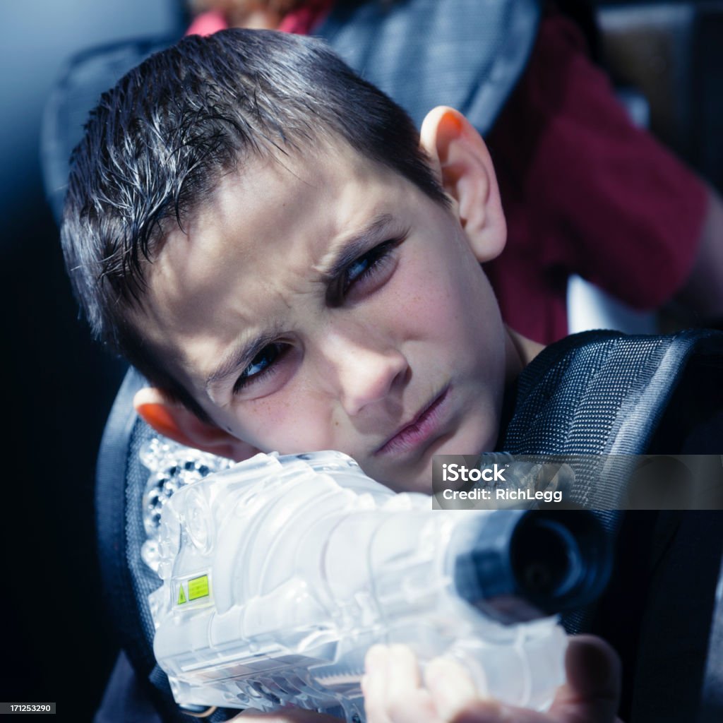 Laser Tag A happy boy playing laser tag. 10-11 Years Stock Photo