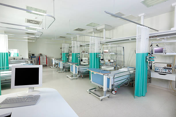 istock Empty beds in a hospital or surgical recovery room 171253720