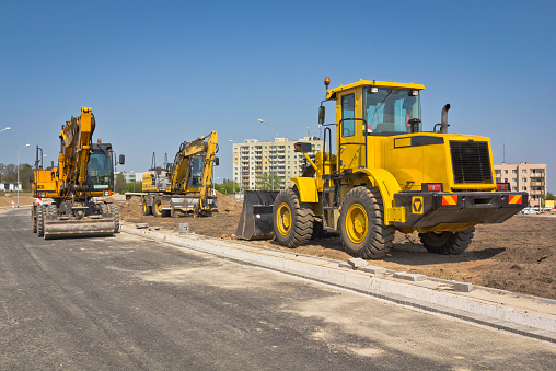 Road construction machinery in a new road construction