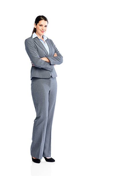 Full length image of successful young business woman with her arms folded on white background
