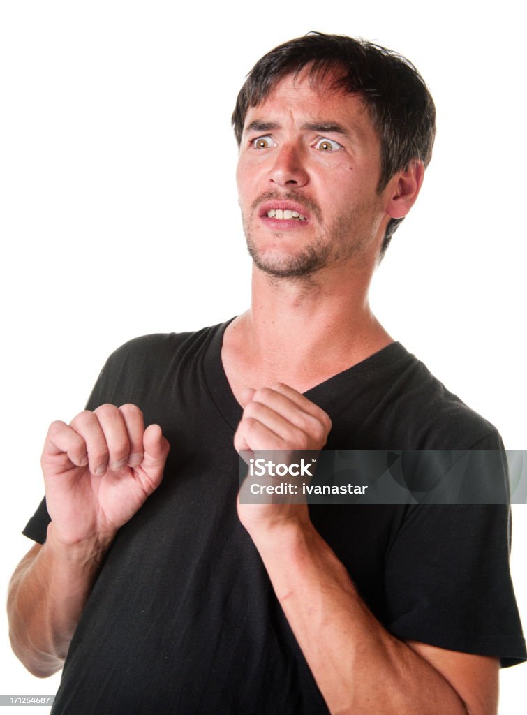 Sorprendido joven mostrando miedo - Foto de stock de Mirar hacia arriba libre de derechos