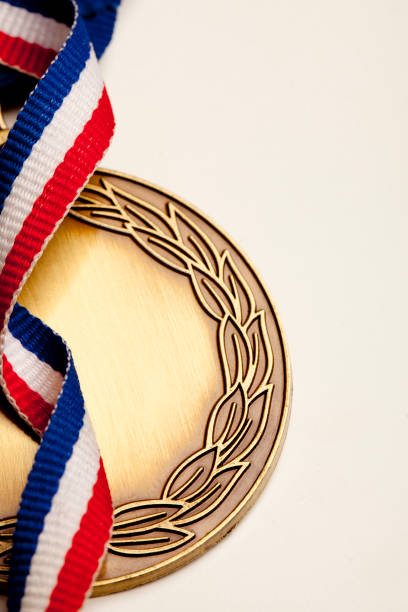 istock A winning gold medal with a leaf imprint and colored ribbon. 171255789