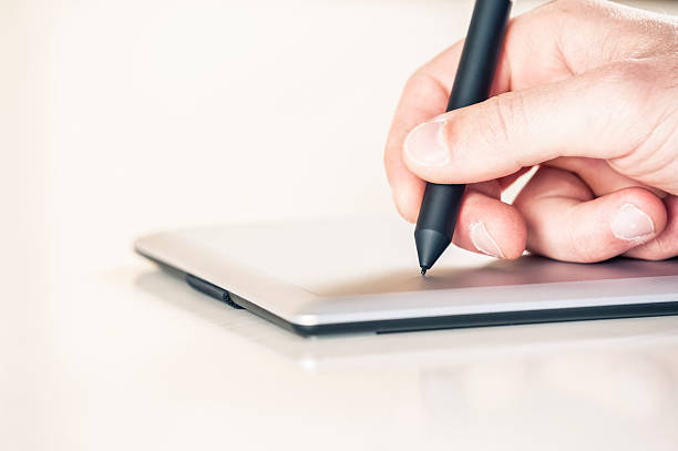 istock Hand is drawing on a digital graphic tablet with pen 171255812