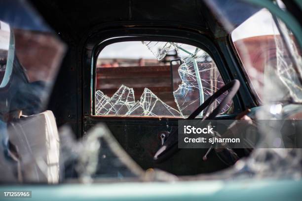 Shiny Reflective And Shattered Window From An Antique Blue Car Stock Photo - Download Image Now