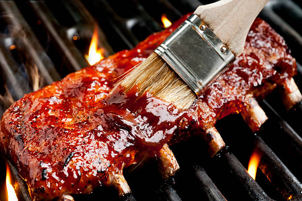Barbecue Ribs Barbecue ribs on the grill.  Please see my portfolio for other food related images. barbeque sauce photos stock pictures, royalty-free photos & images