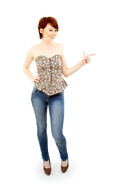 istock Attraktive brunette female with pointing hand on white 171256284