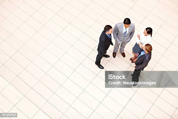 Business Executives In A Casual Discussion Stock Photo - Download Image Now - Adult, Adults Only, Arms Crossed