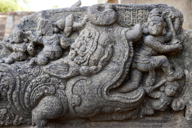 Bas-relief Crocodile like Demon sculpture carved in Temple wall.