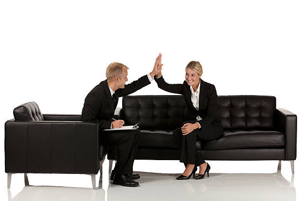 istock Business couple giving high-five to each other 171257530