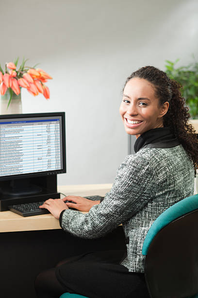 istock Friendly Bank Teller at Work in Retail Banking Counter Vt 171257715