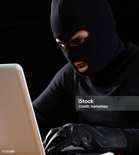 Computer Thief Stock Photo - Download Image Now - 30-39 Years, Adult, Adults Only