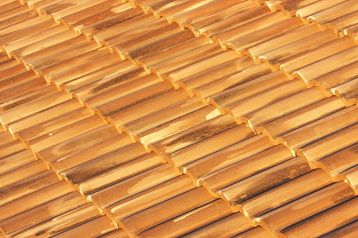 The roof of a private house made of natural ceramic tiles.