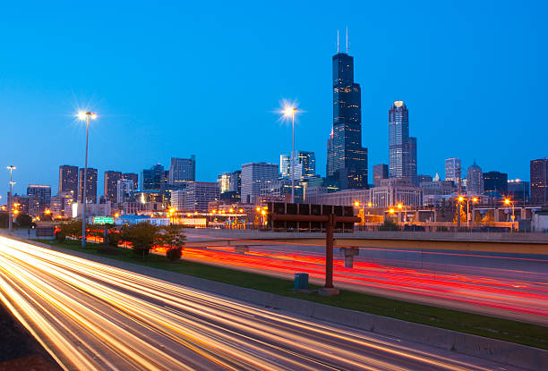 Chicago skyline and freeway at dusk