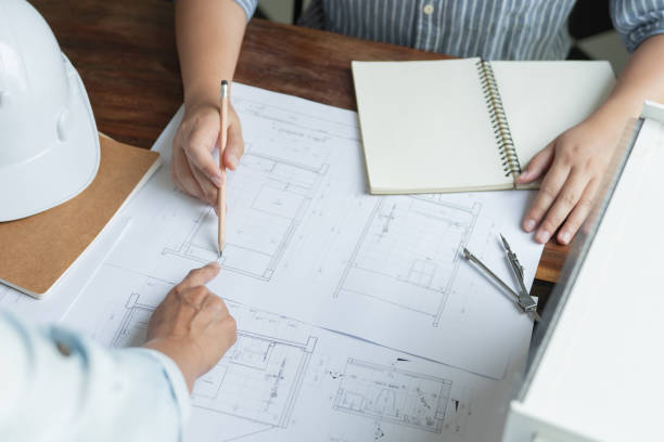 istock Architecture drawing on architectural Creative project business architecture building constructionÂ Industrial engineering Achievement Planning Design on blueprint Teamwork 1712605494