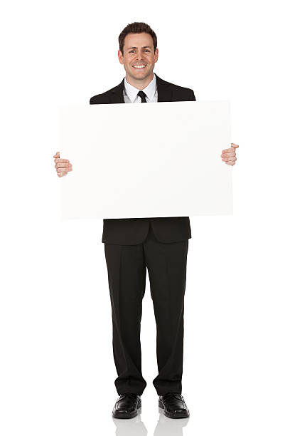 biznesmen posiadający transparent - man holding a sign zdjęcia i obrazy z banku zdjęć