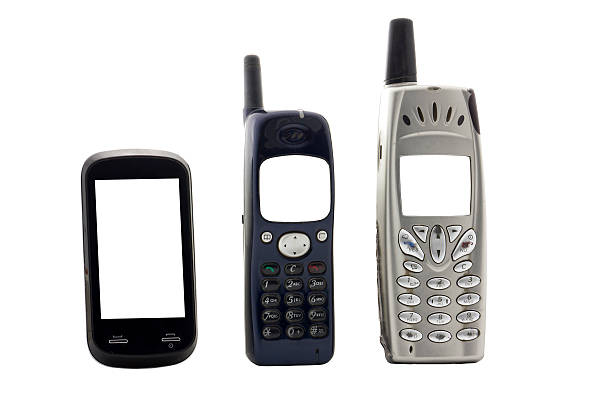 vintage cell phones, cut out on white background stock photo